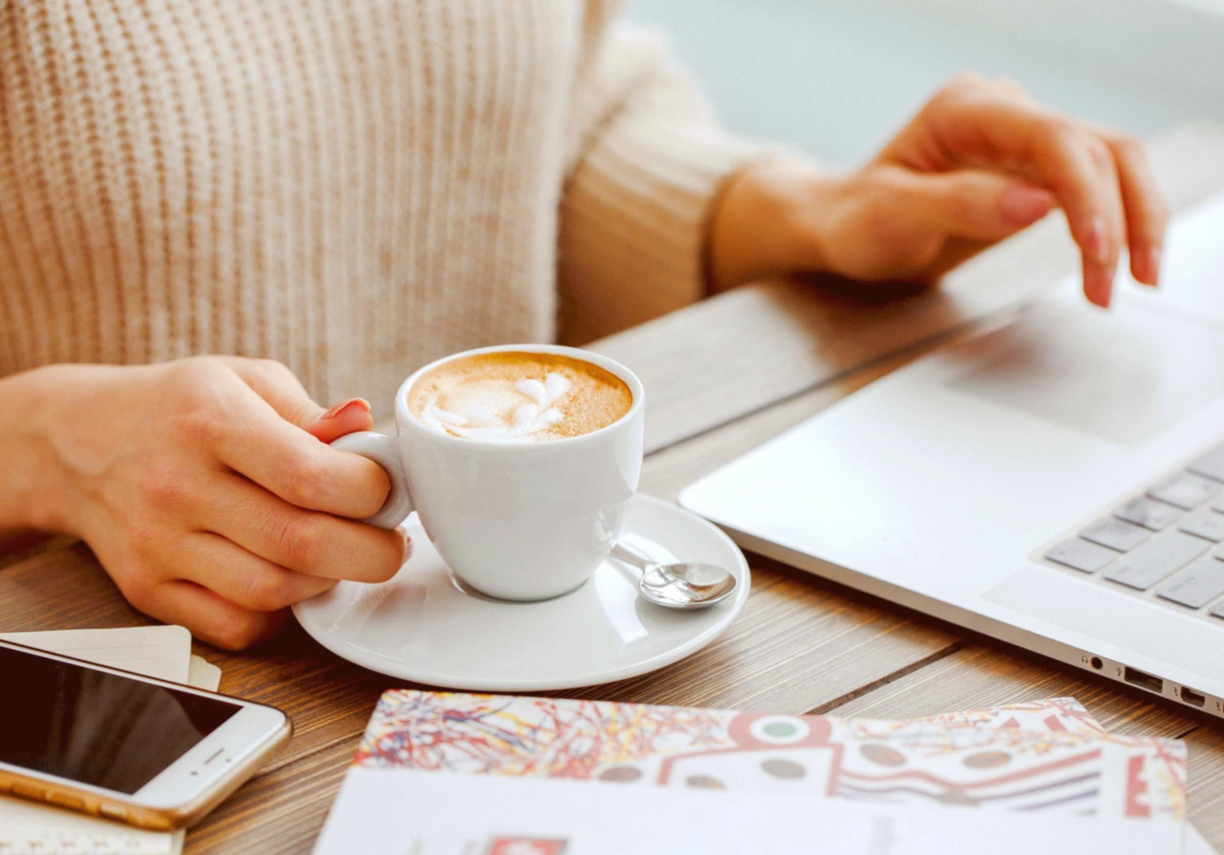 Team collaborating on financial analysis project with documents and laptops