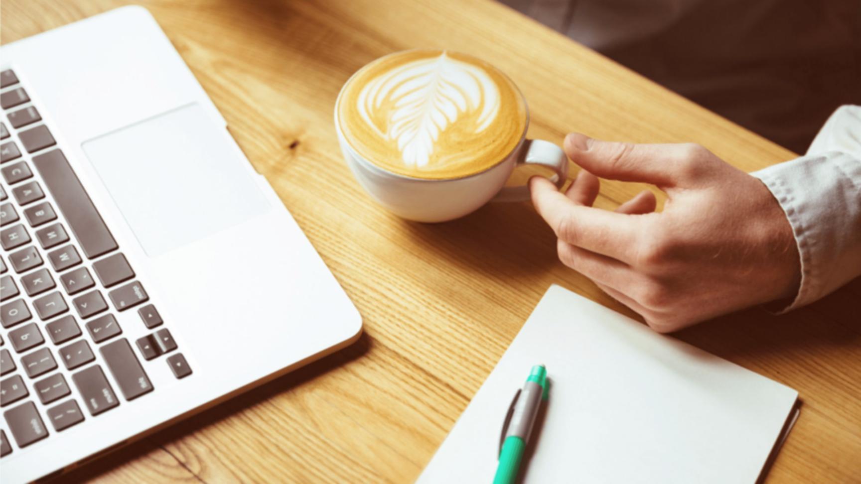 Modern workspace with financial software displaying complex market analysis