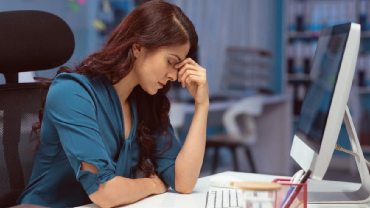 Modern office workspace with financial analysis software displayed on multiple monitors